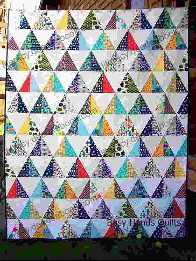 A Quilt Made Of Different Colored Triangles Quilts With An Angle: New Foolproof Grid Method Easy Strip Cutting 15 Projects With Triangles Hexagons Diamonds More (A Field Guide)