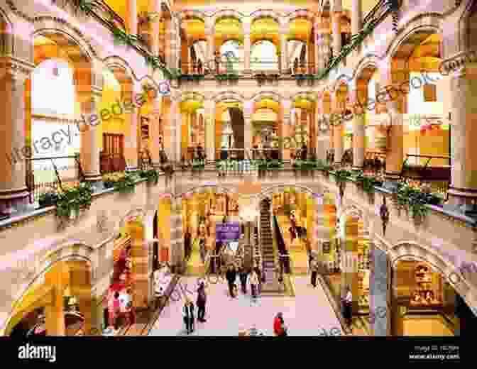 An Opulent Interior Shot Of Magna Plaza, With Its Grand Staircase, Marble Floors, And Elegant Boutiques. Amsterdam In Love Martin Soorjoo